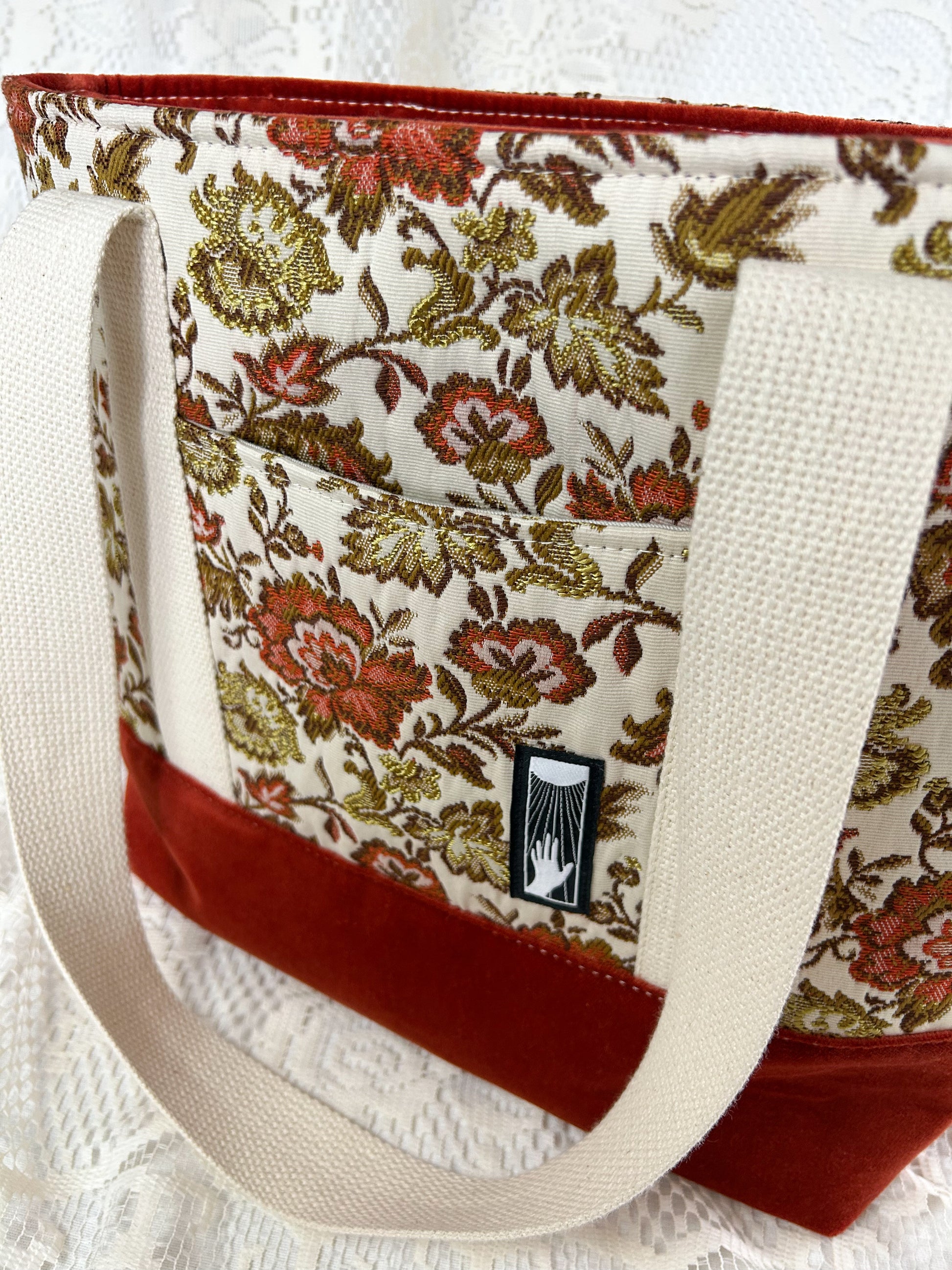 Close up of the same tote bag showing the exterior slip pocket