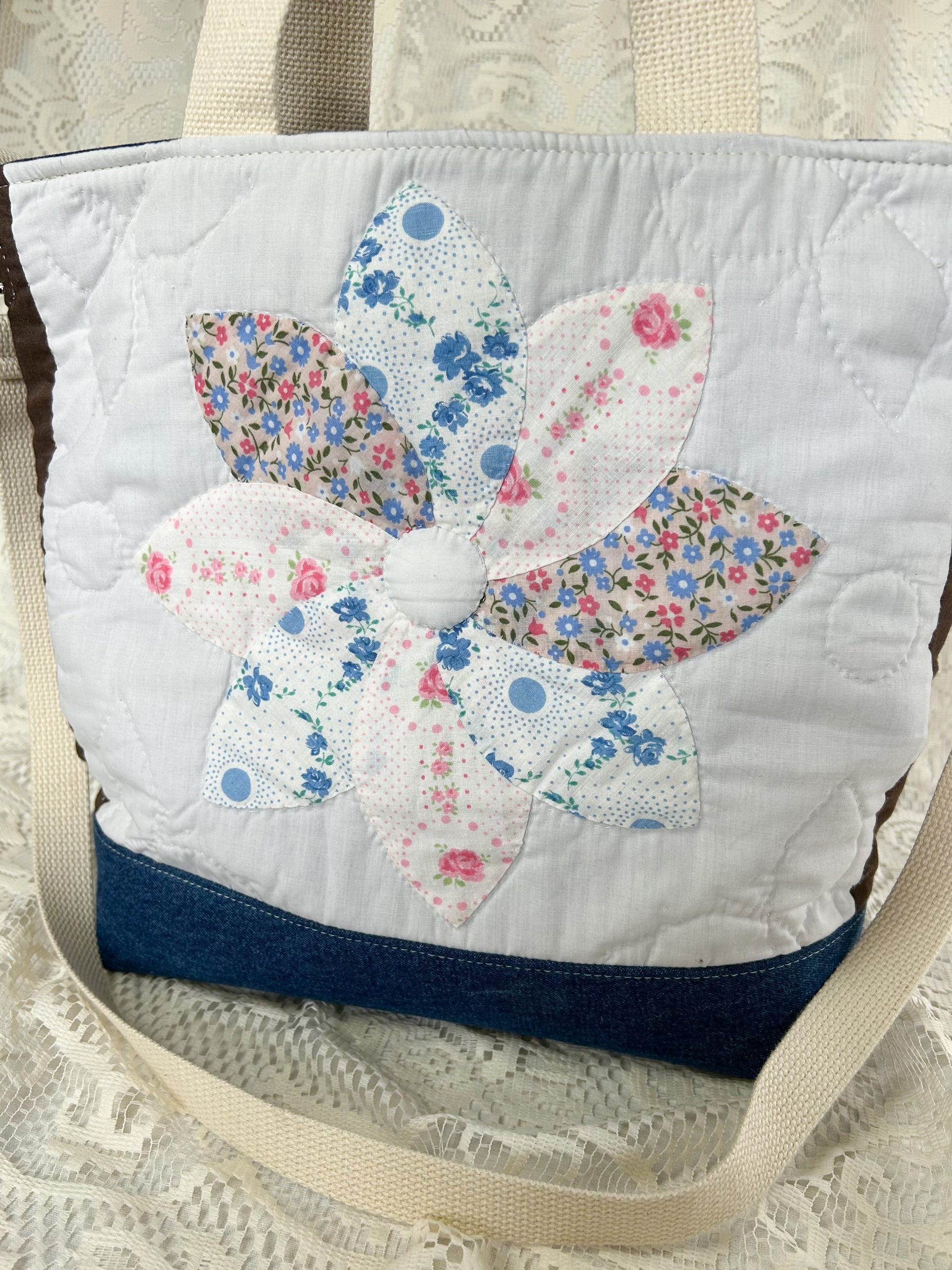 Close up of the quilted flower on the front of the tote bag