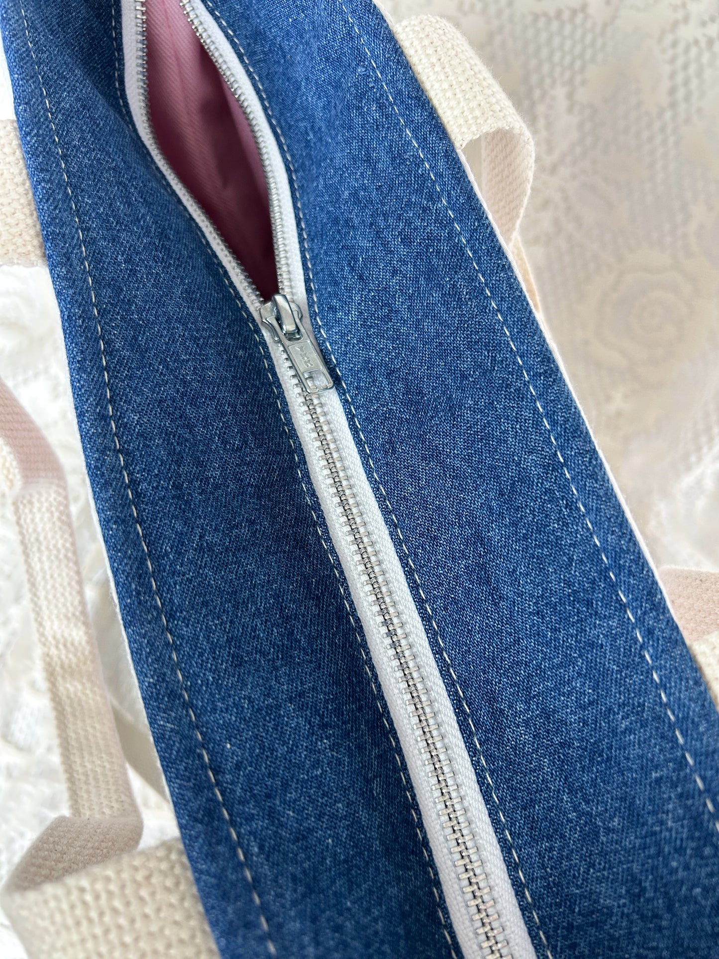 Top view of the tote bag showing the metal zipper 