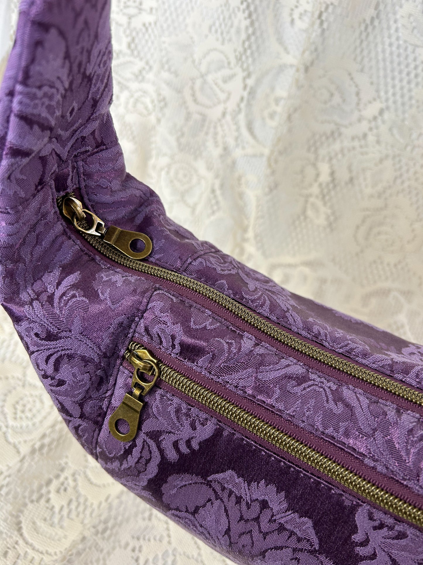 Top view of the crescent bag showing both exterior zippers