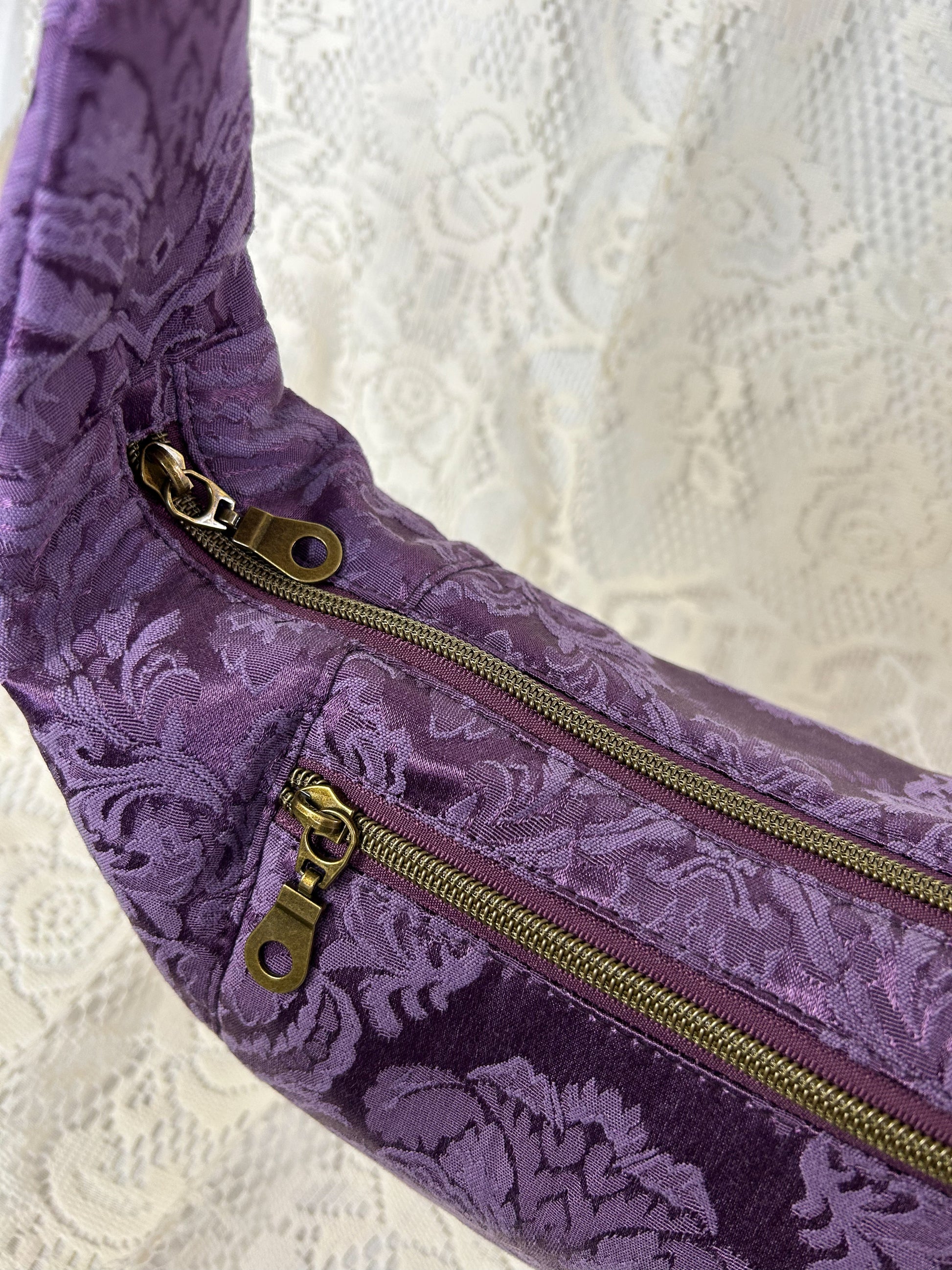 Top view of the crescent bag showing both exterior zippers